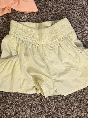 Free People Smocked Waist Athletic Shorts in Pale Yellow